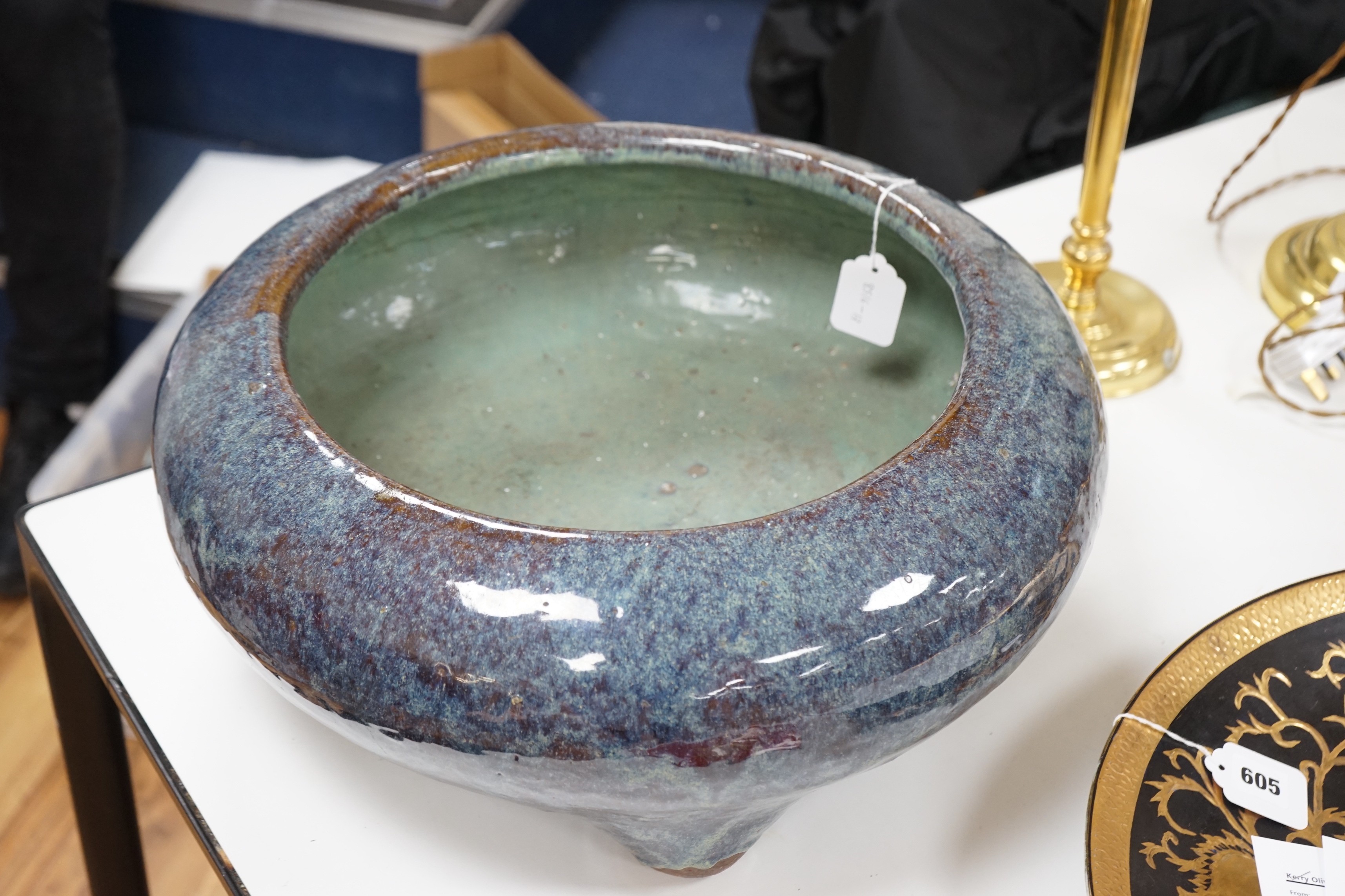 A large Chinese Shiwan stoneware tripod vessel or censer, late 19/early 20th century, 47cm diameter